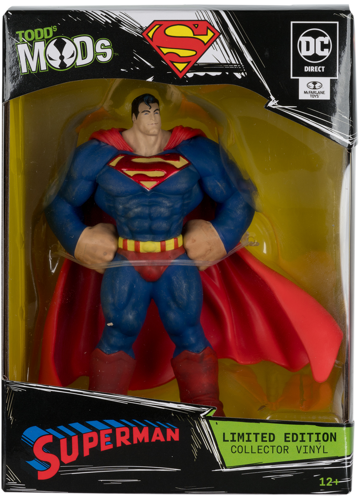 Superman akciófigura dobozban. Kék öltönyt, piros köpenyt és csizmát visel. A dobozon logók vannak, és azt írja: "Collector Vinyl".