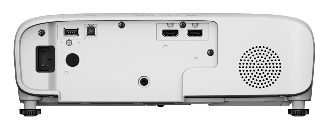 Tył białego projektora. Posiada port zasilania, USB, porty HDMI i głośnik. Regulowane nóżki na dole.