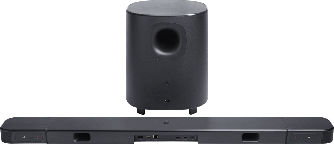 Fekete JBL soundbar és mélynyomó szett. A mélynyomó henger alakú, a soundbar téglalap alakú.