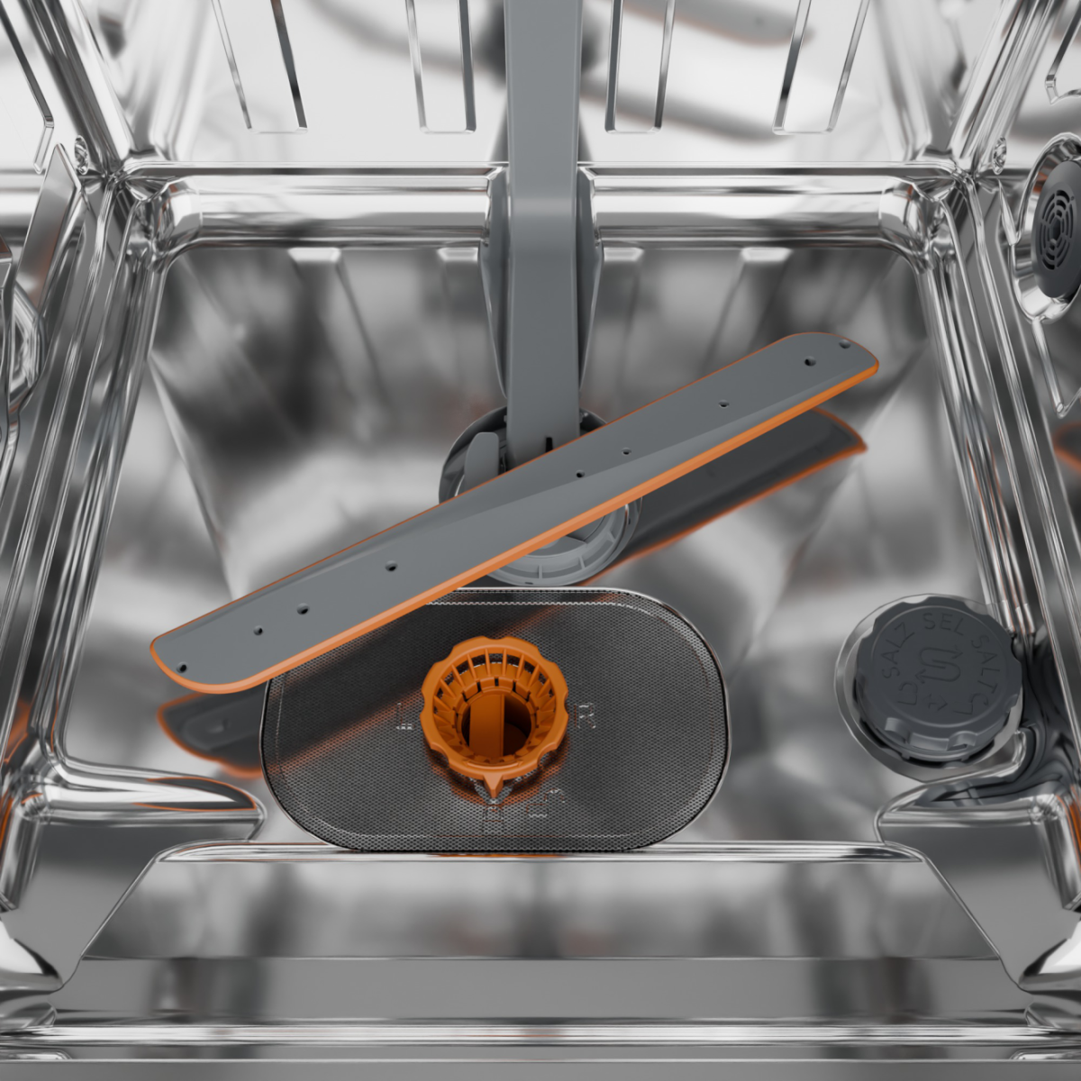 Wnętrze zmywarki. Szare i pomarańczowe ramiona spryskiwaczy, filtr i pojemnik na sól widoczne na tle wnętrza ze stali nierdzewnej.