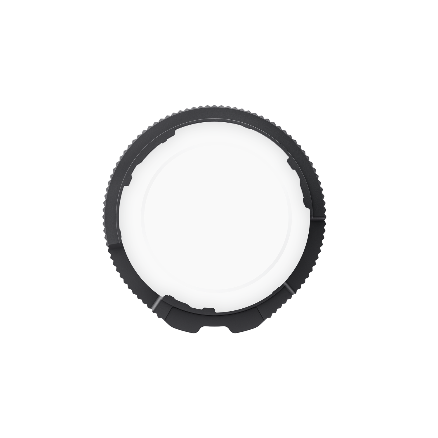 A black circular object with a toothed outer edge and a white center, against a white background.