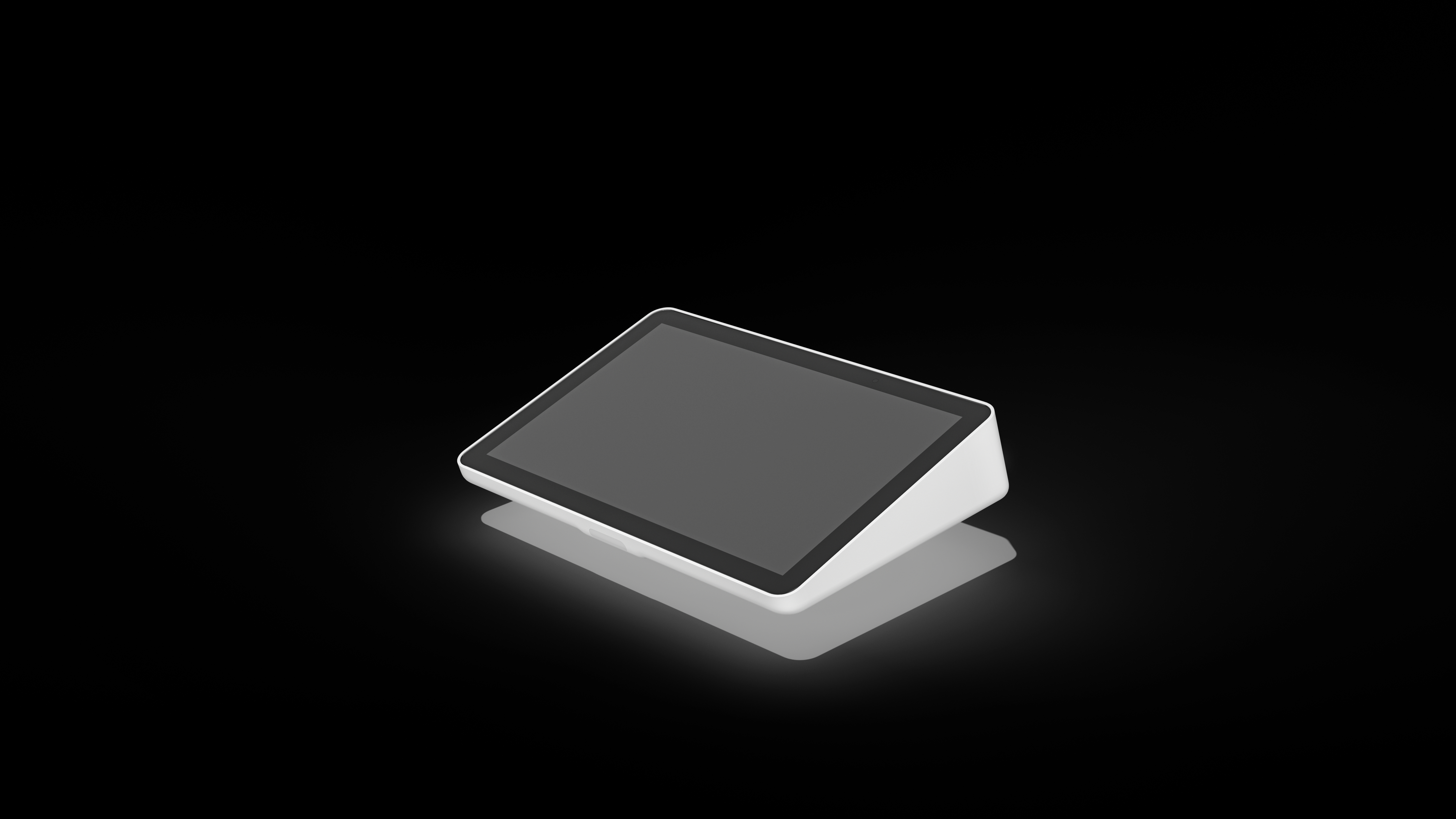 Ein weißes Tablet mit schwarzem Bildschirm liegt auf einer reflektierenden schwarzen Oberfläche. Das Tablet wirft einen Schatten.