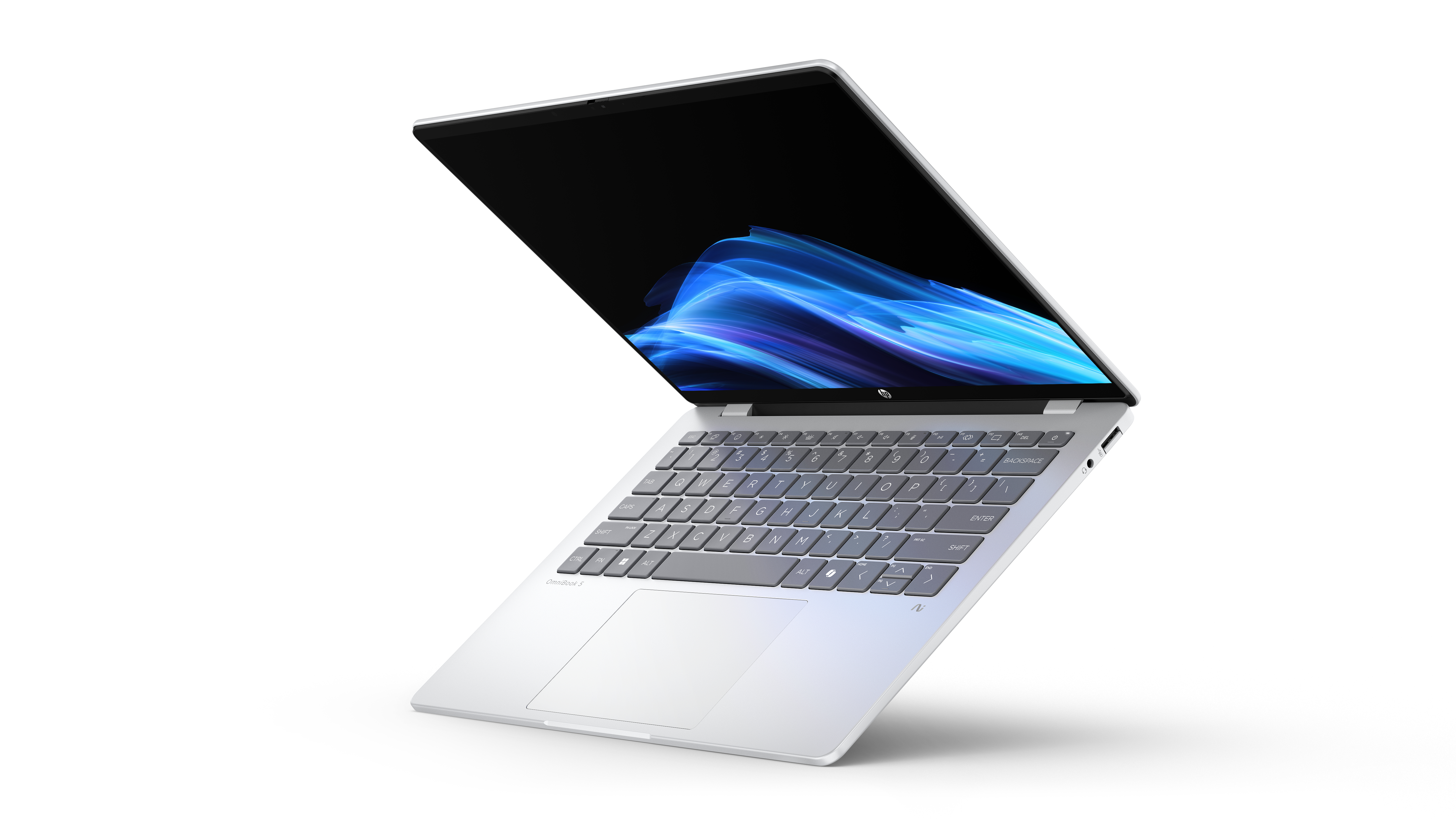 Ein silberner Laptop mit schwarzem Bildschirm und blauen Grafiken ist geöffnet. Die Tastatur ist sichtbar, vor weißem Hintergrund.