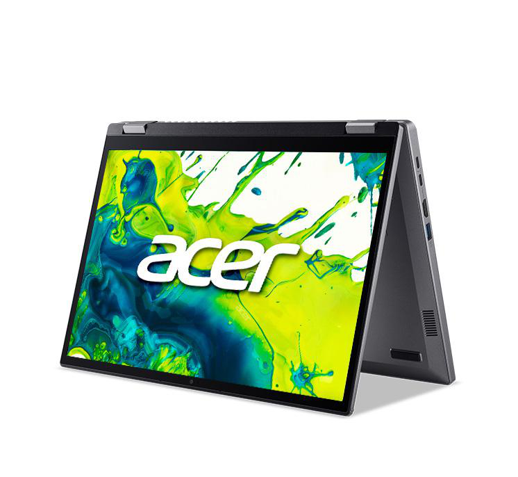 Ein Acer-Laptop ist geöffnet. Der Bildschirm zeigt einen Spritzer Gelb und Grün mit dem Acer-Logo. Der Laptop ist grau und in einem Winkel geöffnet.