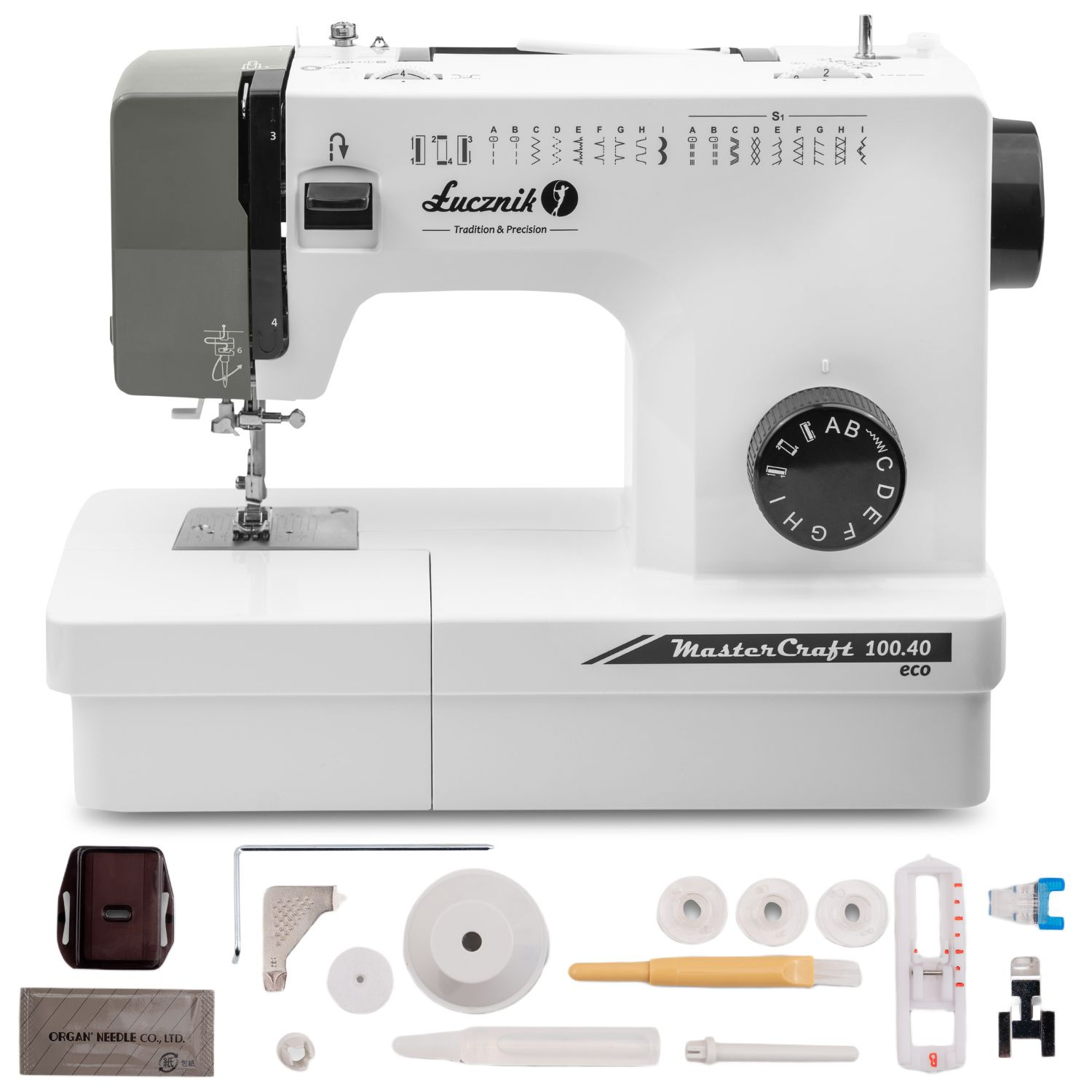 Biała maszyna do szycia z szarymi akcentami, wraz z akcesoriami. Maszyna ma napis 'MasterCraft' i 'Lucznik'.