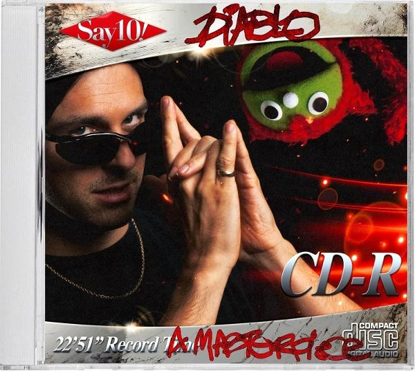 CD-Cover mit Mann mit Sonnenbrille und Puppe. Roter CD-R-Text. Diablo steht oben.