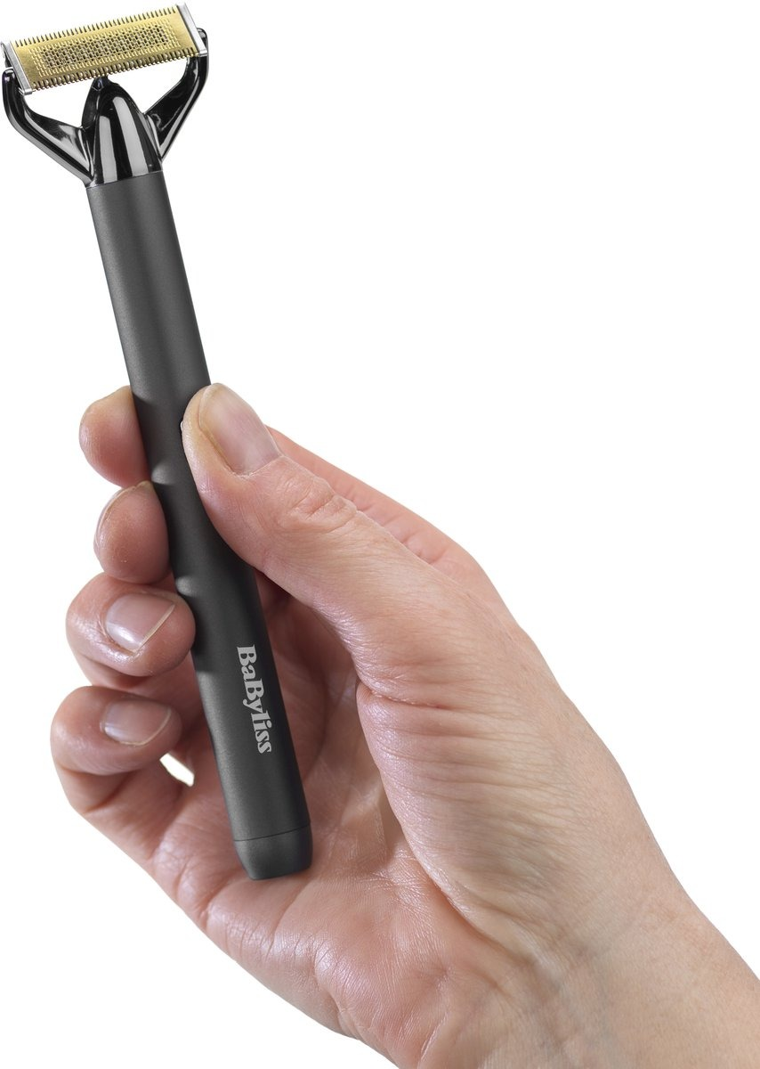 A hand holds a black BaByliss shaver against a white background. The shaver has a gold blade and a dark handle.