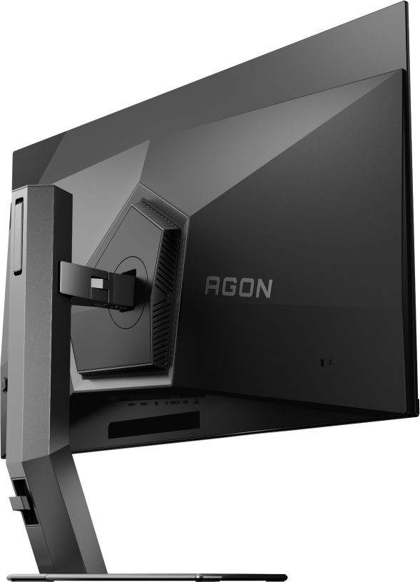 Un dos de moniteur noir avec le logo AGON. Il possède un support et plusieurs ports en bas. Le moniteur est incliné.