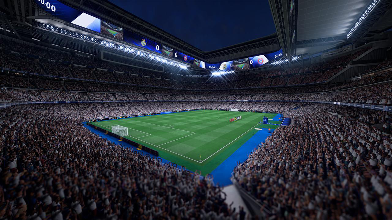 Ein volles Stadion bei Nacht. Ein grünes Fußballfeld in der Mitte mit einem weißen Tor. Fans sind auf den Tribünen.
