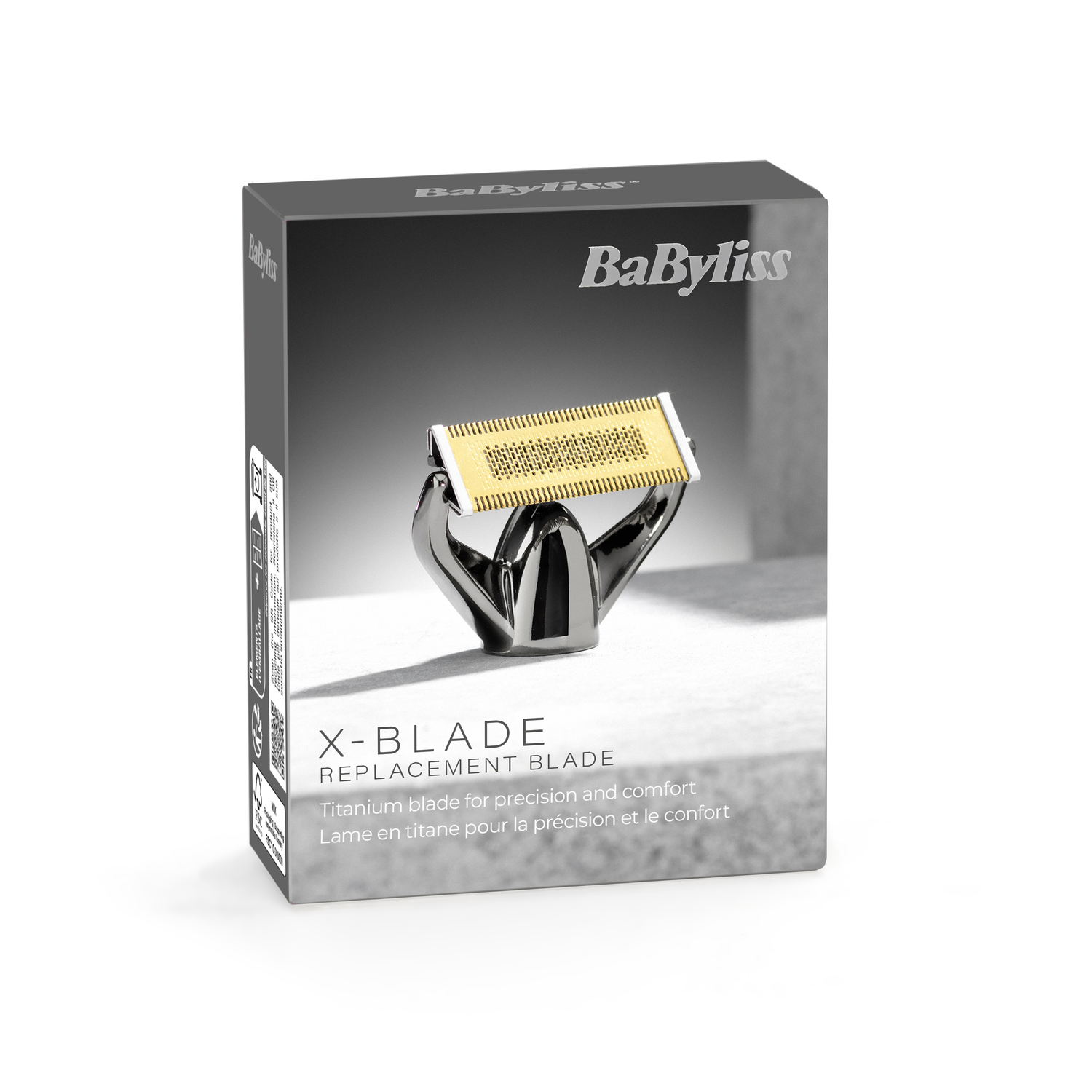 Box with a razor blade. The box says BaByliss, X-BLADE, and Replacement Blade. The blade is gold and silver.