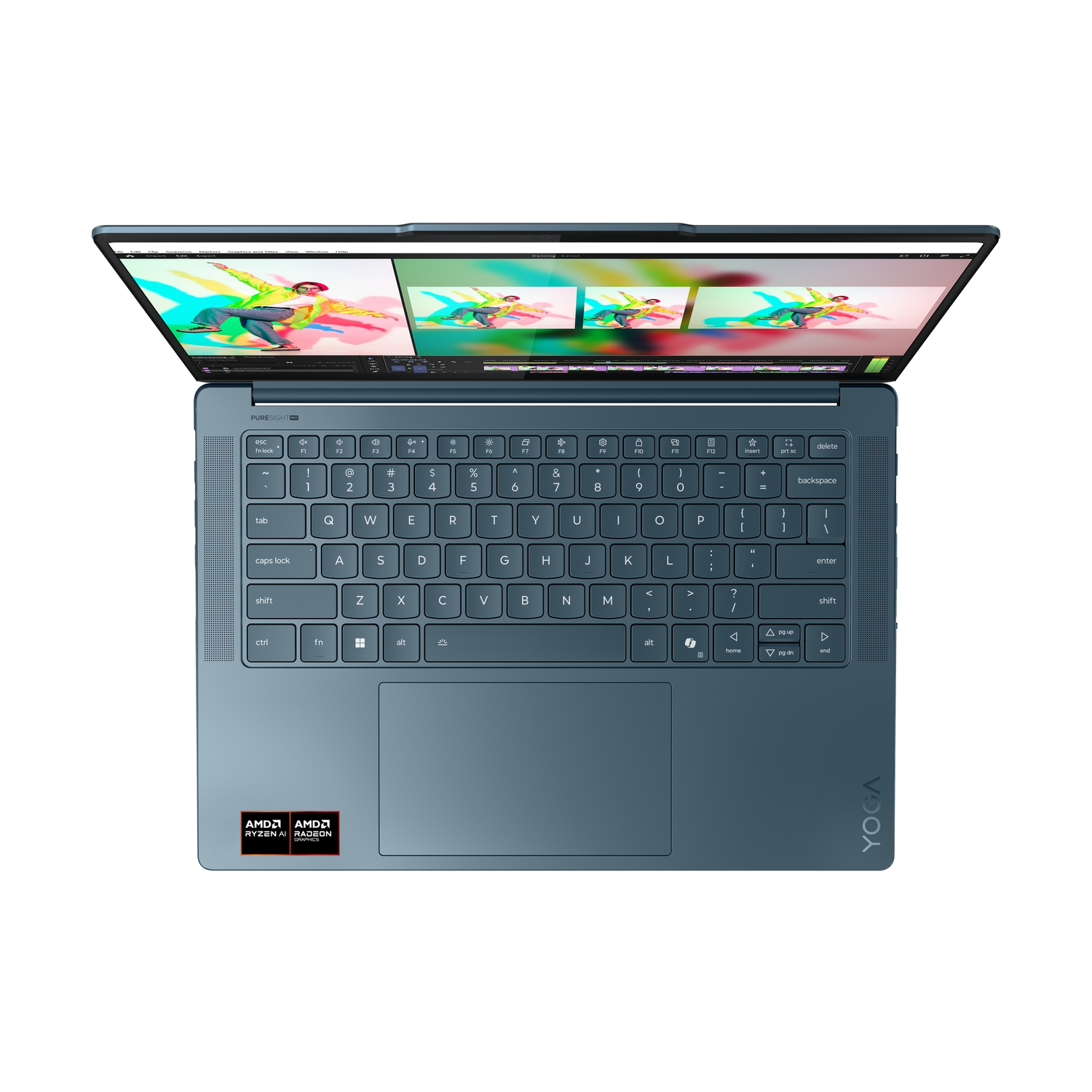 An open blue laptop shows a colorful video editing interface. The keyboard is in the foreground with AMD Ryzen AI stickers.