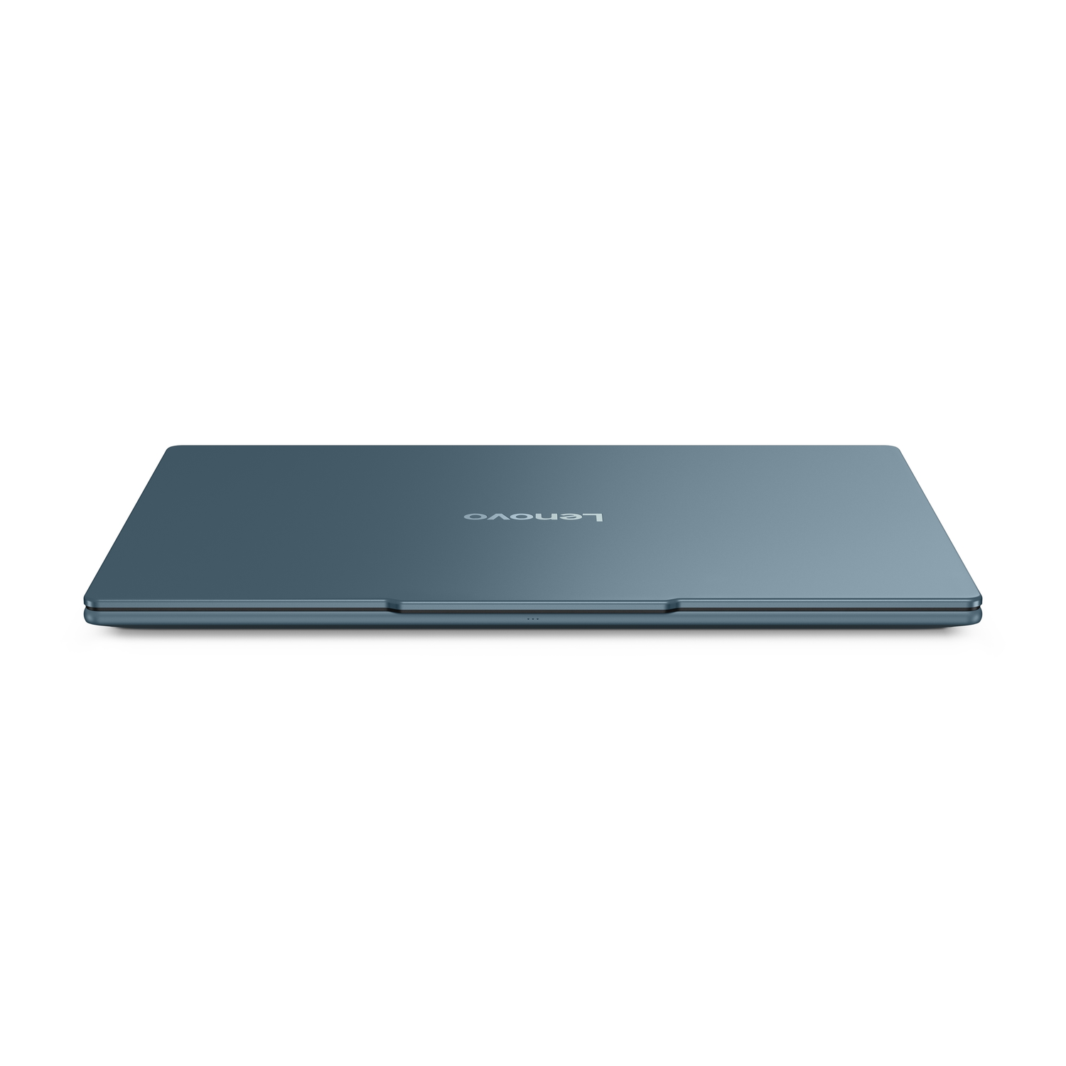 Closed teal Lenovo laptop on a white background. The Lenovo logo is visible. The laptop is slightly angled.