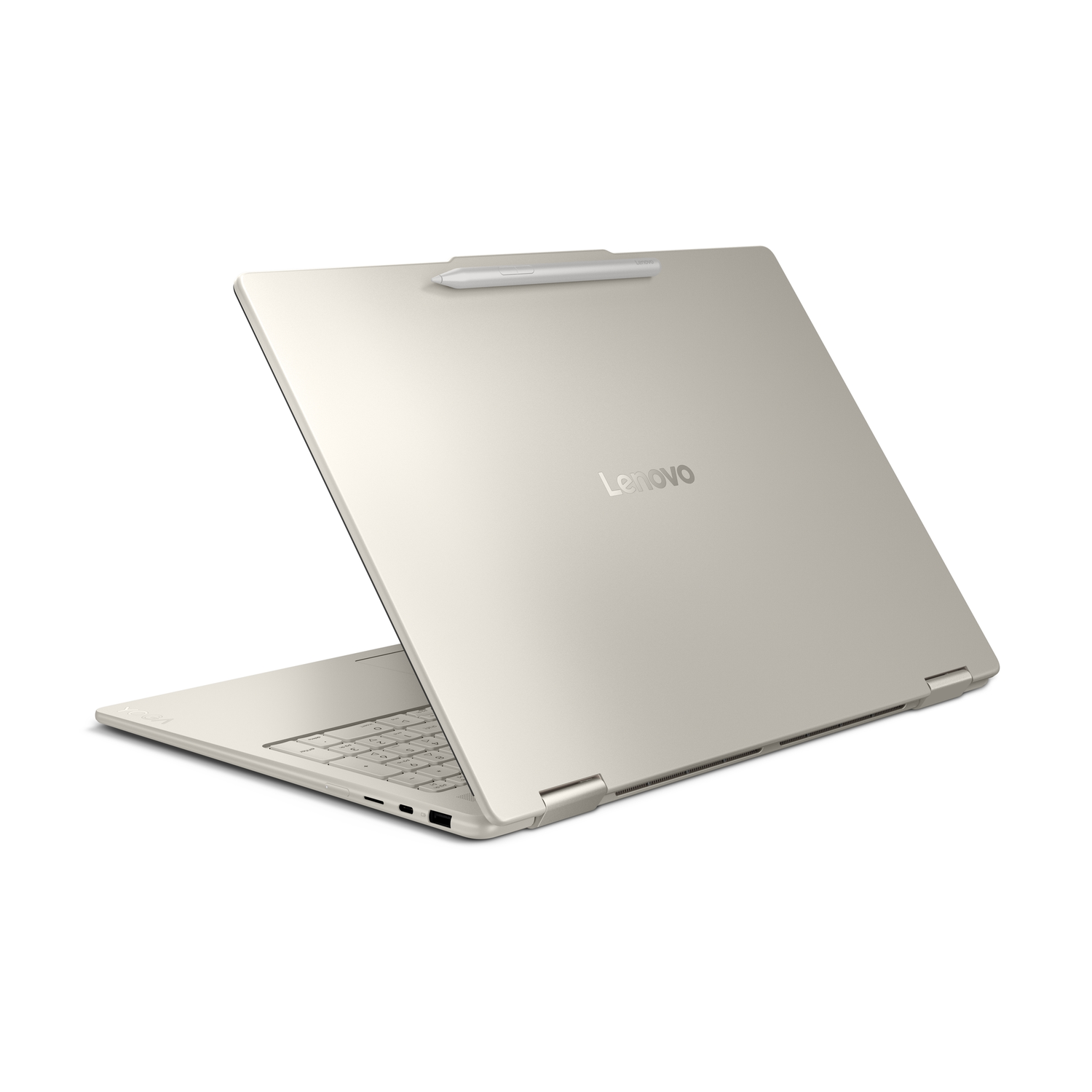 A gold Lenovo laptop is slightly open, showing keyboard and screen. A stylus rests on the top. The Lenovo logo is visible.