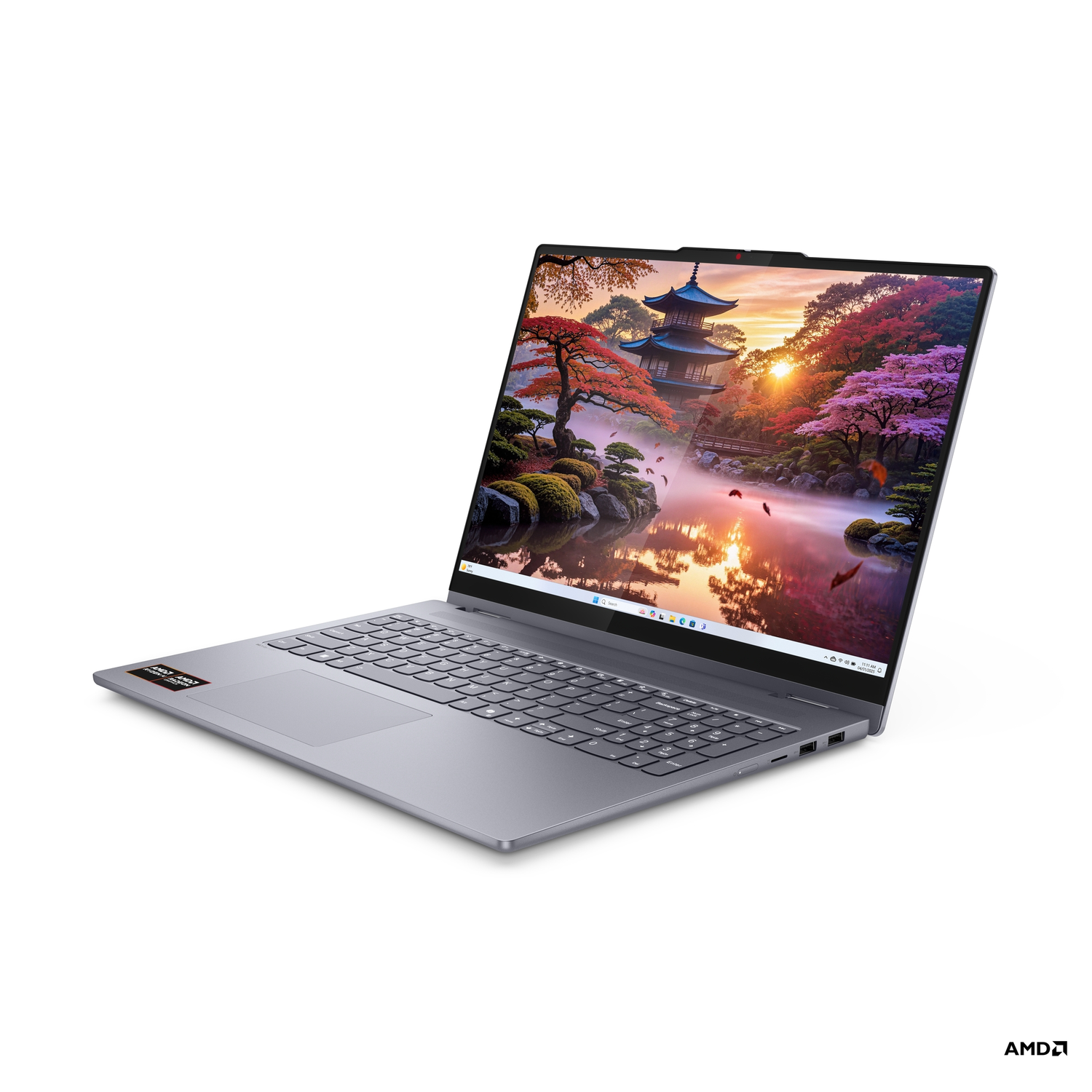 Een zilveren laptop toont een Japanse tuin. De laptop is open en iets gekanteld. Het AMD-logo staat rechtsonder.