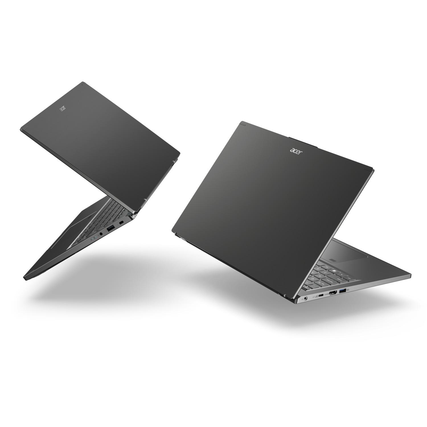Two Acer laptops, dark gray, open. One is at an angle, other is more frontal. Both are on a white background, with subtle shadows.