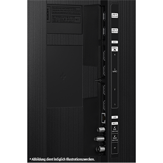 Schwarze TV-Rückwand mit Anschlüssen wie HDMI, USB und anderen. Enthält einen Aufkleber und verschiedene Anschlüsse.