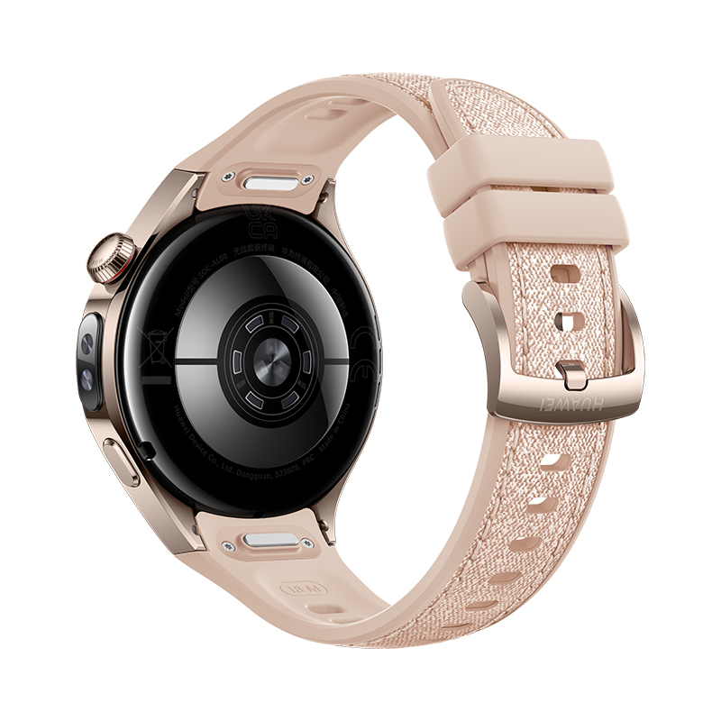 Primer plano de un reloj inteligente con correa rosa claro. La esfera es negra con detalles plateados y caja dorada.