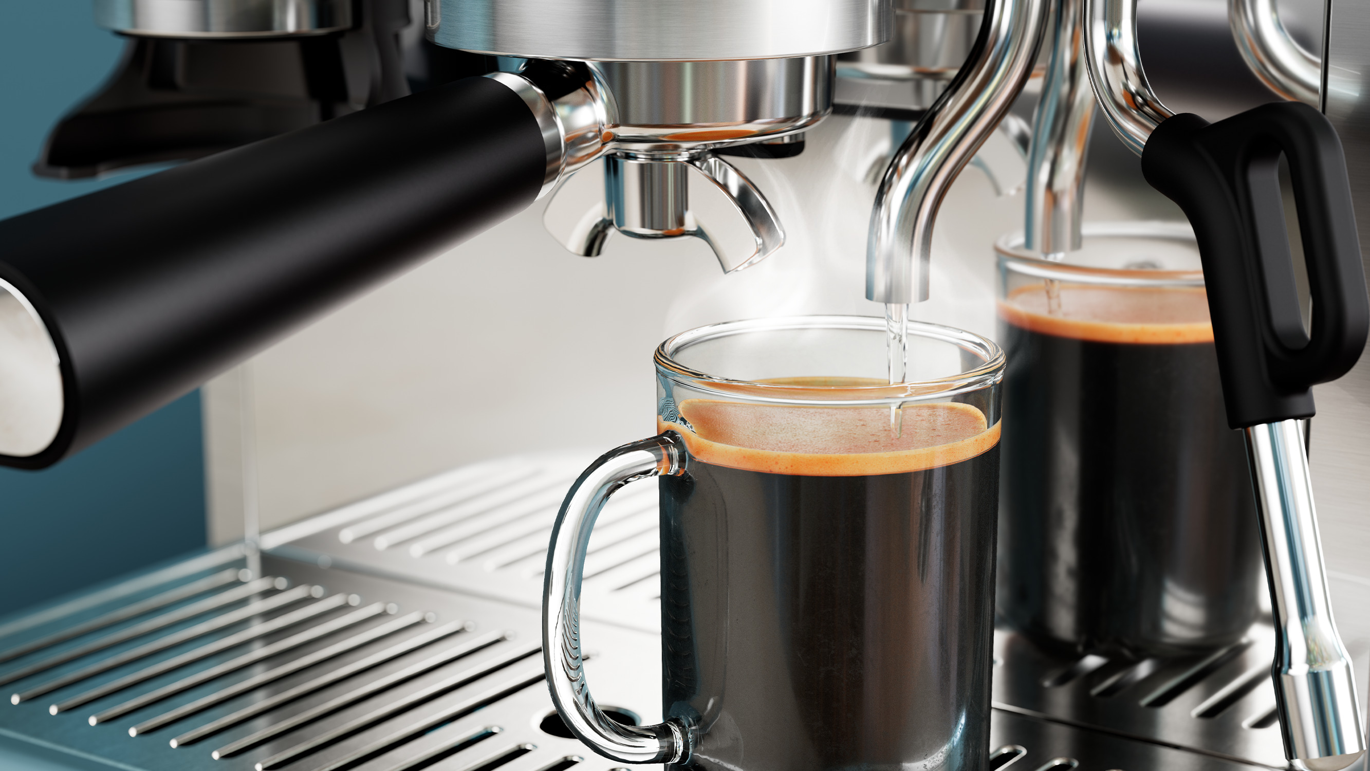 Máquina de espresso dispensando café en una taza de vidrio. El café es oscuro con crema marrón claro.