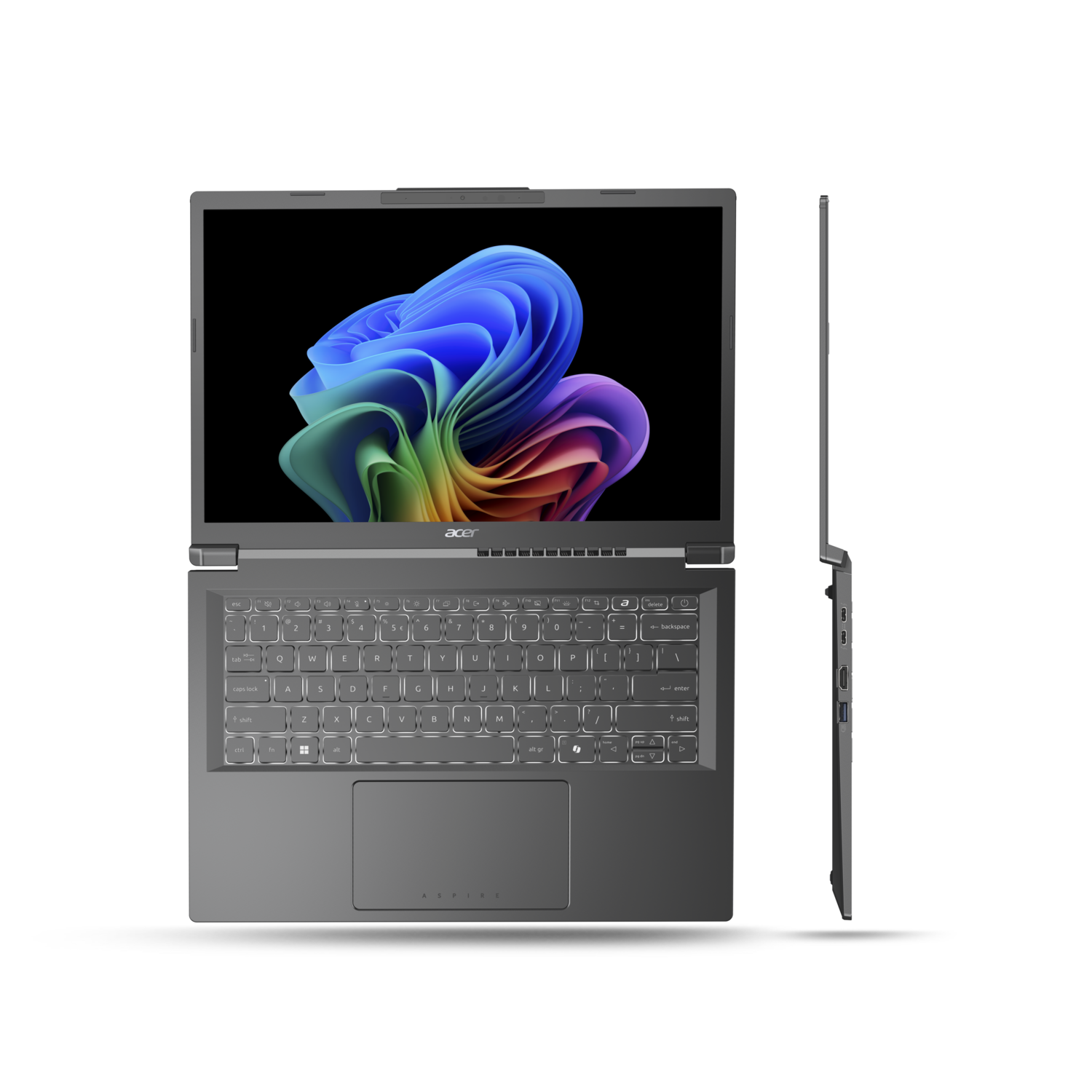 A gray Acer laptop is open, displaying a colorful abstract image. The laptop is on a black background with a side view.
