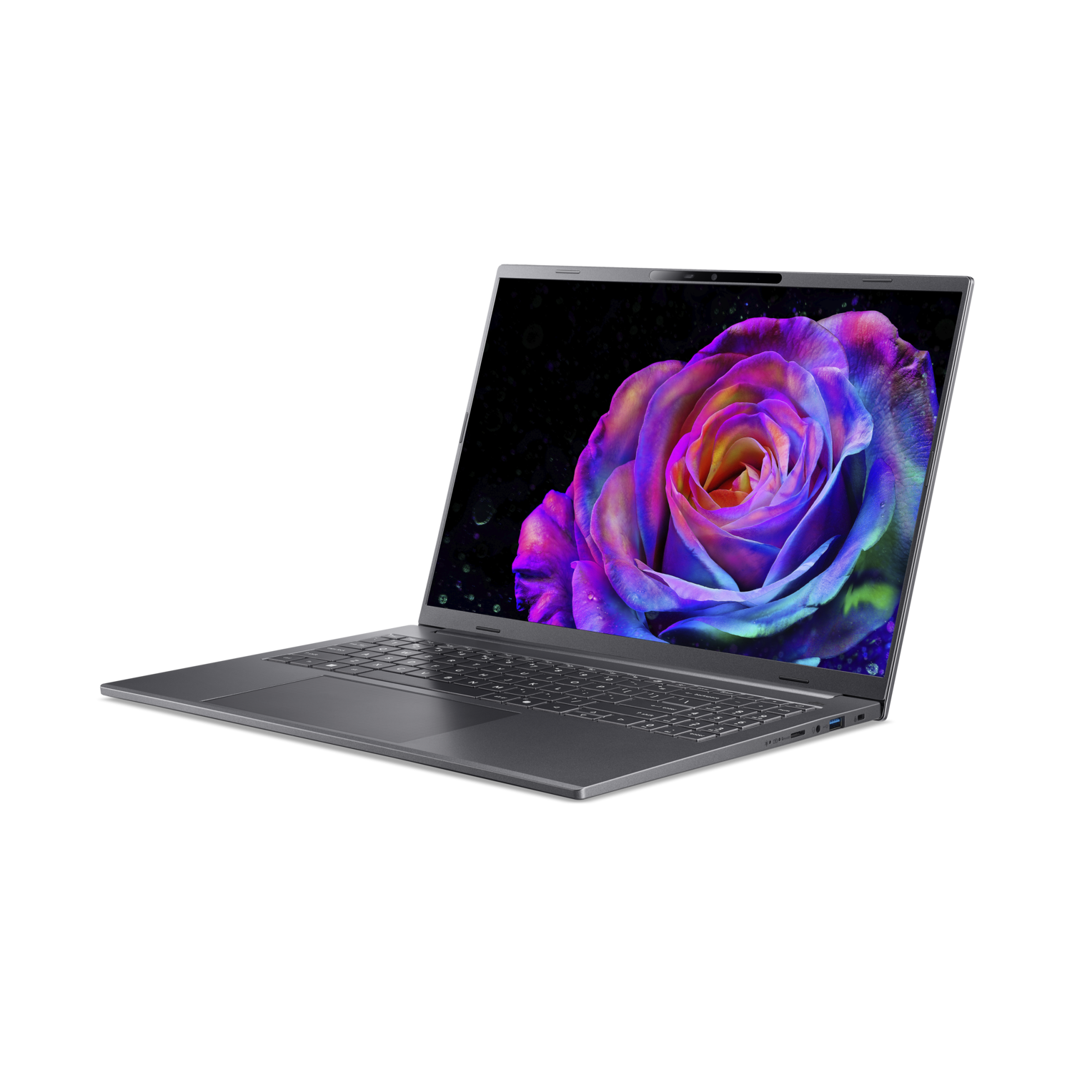 Een zilveren laptop toont een kleurrijke roos op het scherm. De achtergrond is effen zwart.