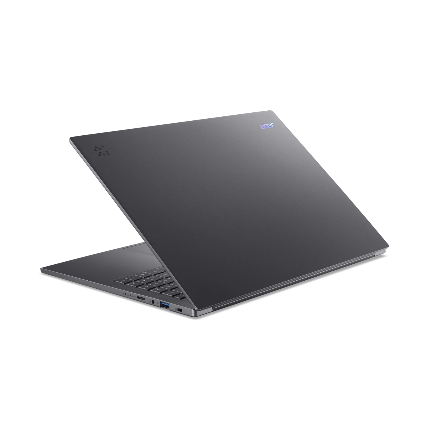 A gray Acer laptop is open on a black surface. The keyboard and ports are visible. The Acer logo is on the top.