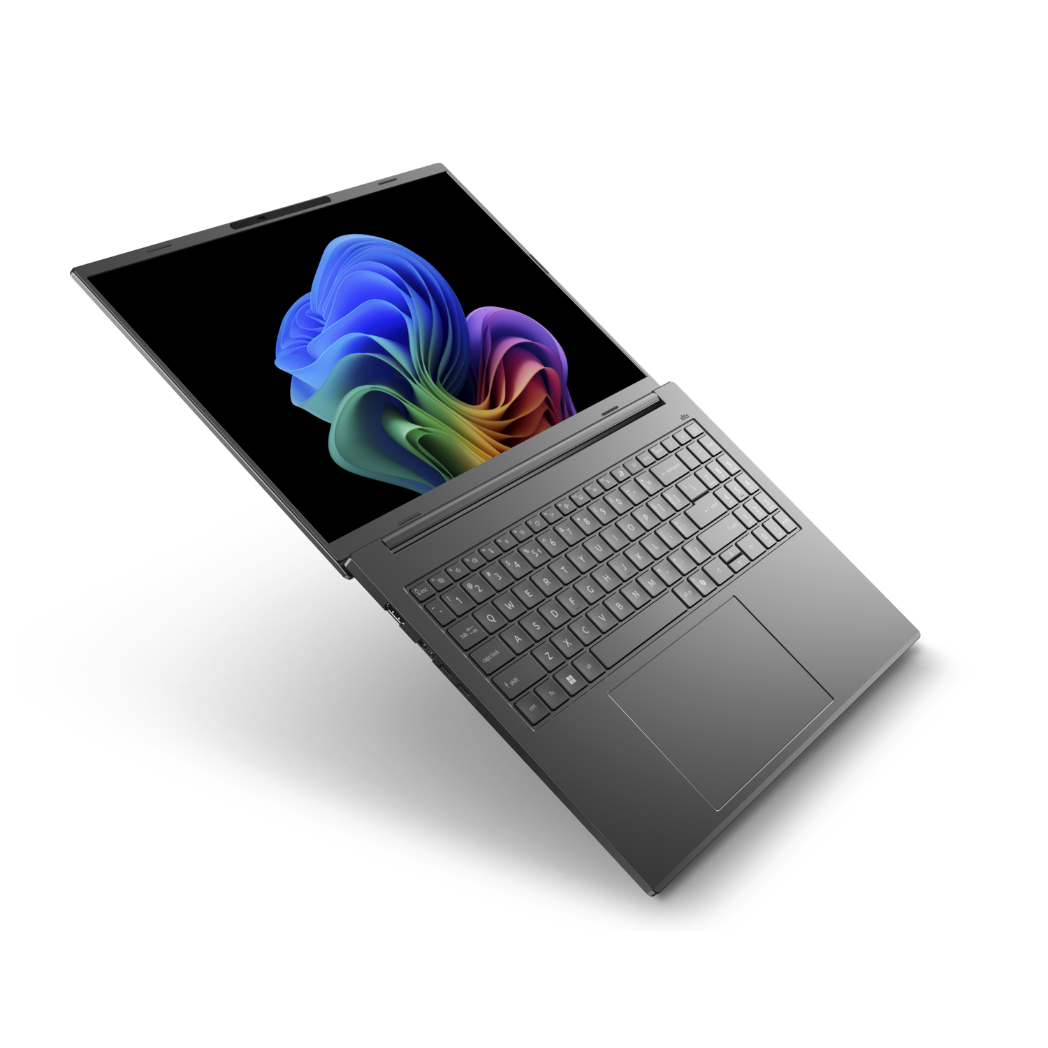 A gray laptop is open, displaying a colorful abstract image. The keyboard is visible, and the laptop is on a white surface.