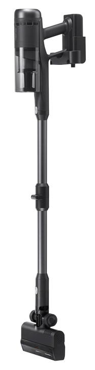 Czarny odkurzacz bezprzewodowy stoi pionowo. Ma długi uchwyt, pojemnik na kurz i zmotoryzowaną głowicę szczotki.