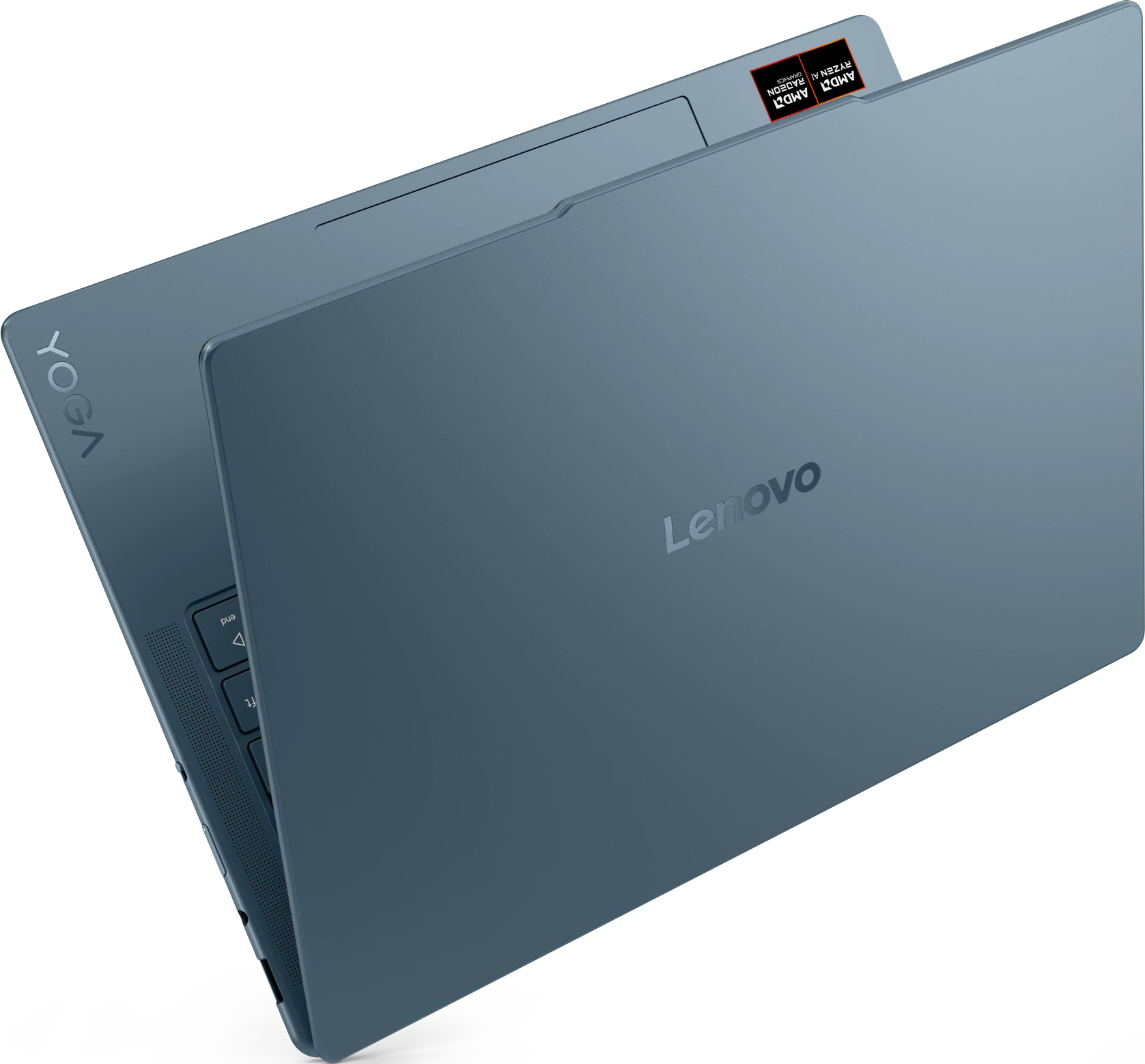 Un ordinateur portable Lenovo Yoga bleu est ouvert. Le logo Lenovo est visible. Le clavier et l'autocollant AMD Ryzen sont également visibles.