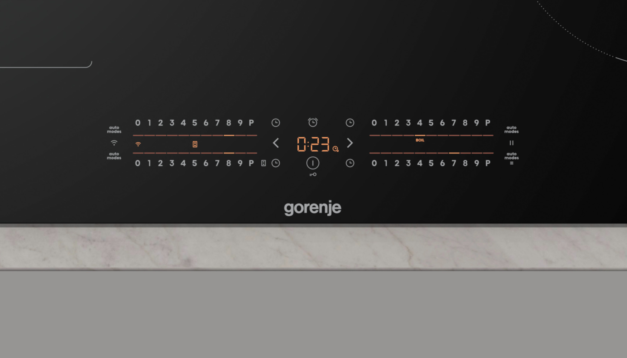 Czarna płyta indukcyjna z wyświetlaczem 0:23, przyciskami sterowania i marką 'gorenje'.