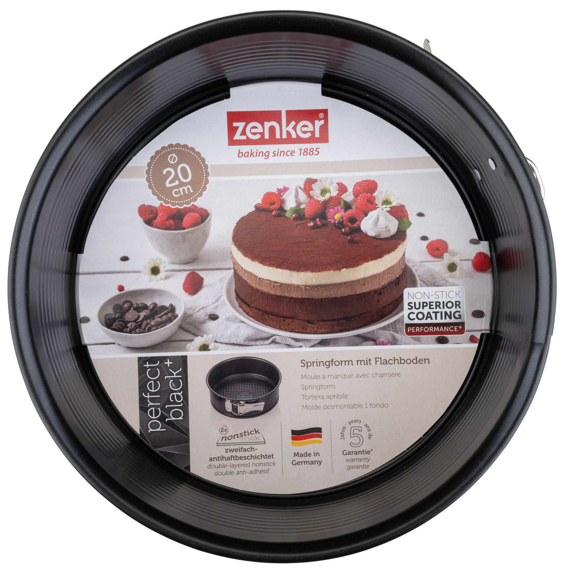 Schwarze Springform mit Kuchen. Die Pfanne hat ein Etikett mit Text und einen Kuchen mit Beeren.