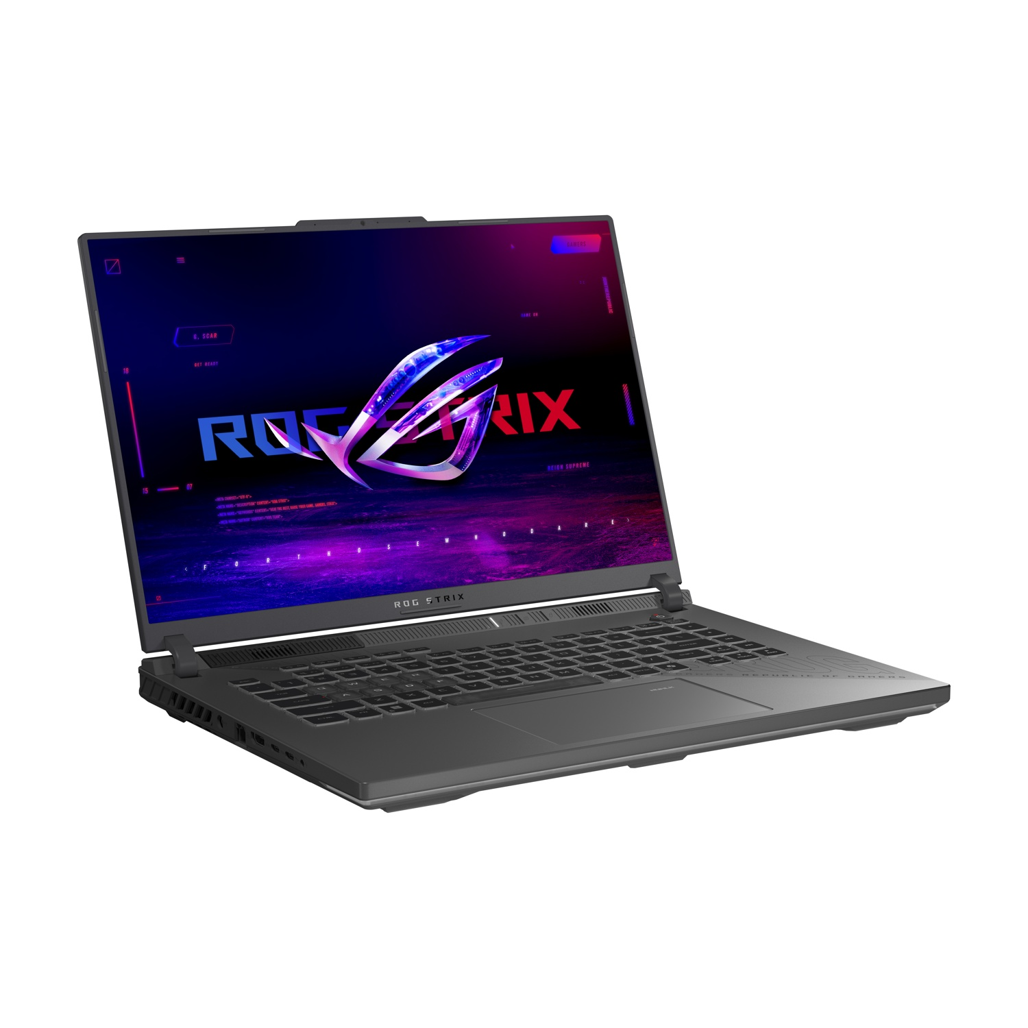 Un laptop grigio ROG Strix è aperto, mostrando un logo colorato. La tastiera è visibile. Lo sfondo è bianco.