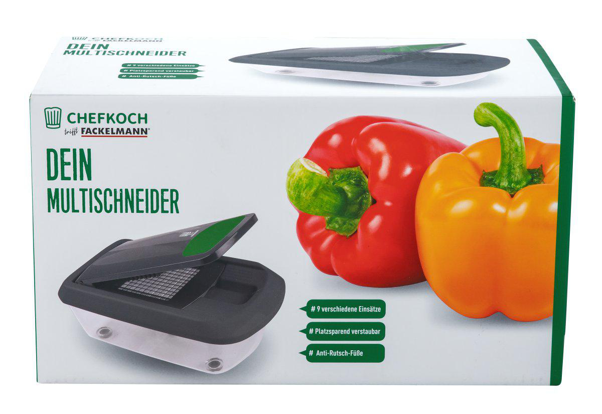 Schachtel mit einem Multischneider und Paprika. Rote und gelbe Paprika auf der Schachtel. Der Schneider ist schwarz und weiß.