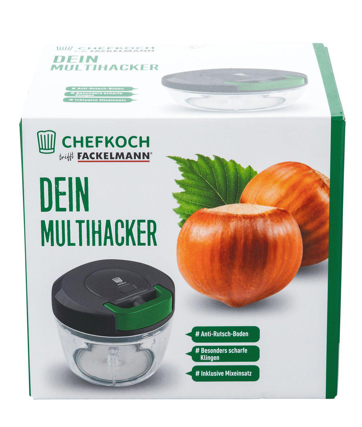 Schachtel mit einem Zerkleinerer und zwei Haselnüssen. Auf der Schachtel stehen die Wörter 'DEIN MULTIHACKER' und 'CHEFKOCH trifft FACKELMANN'.
