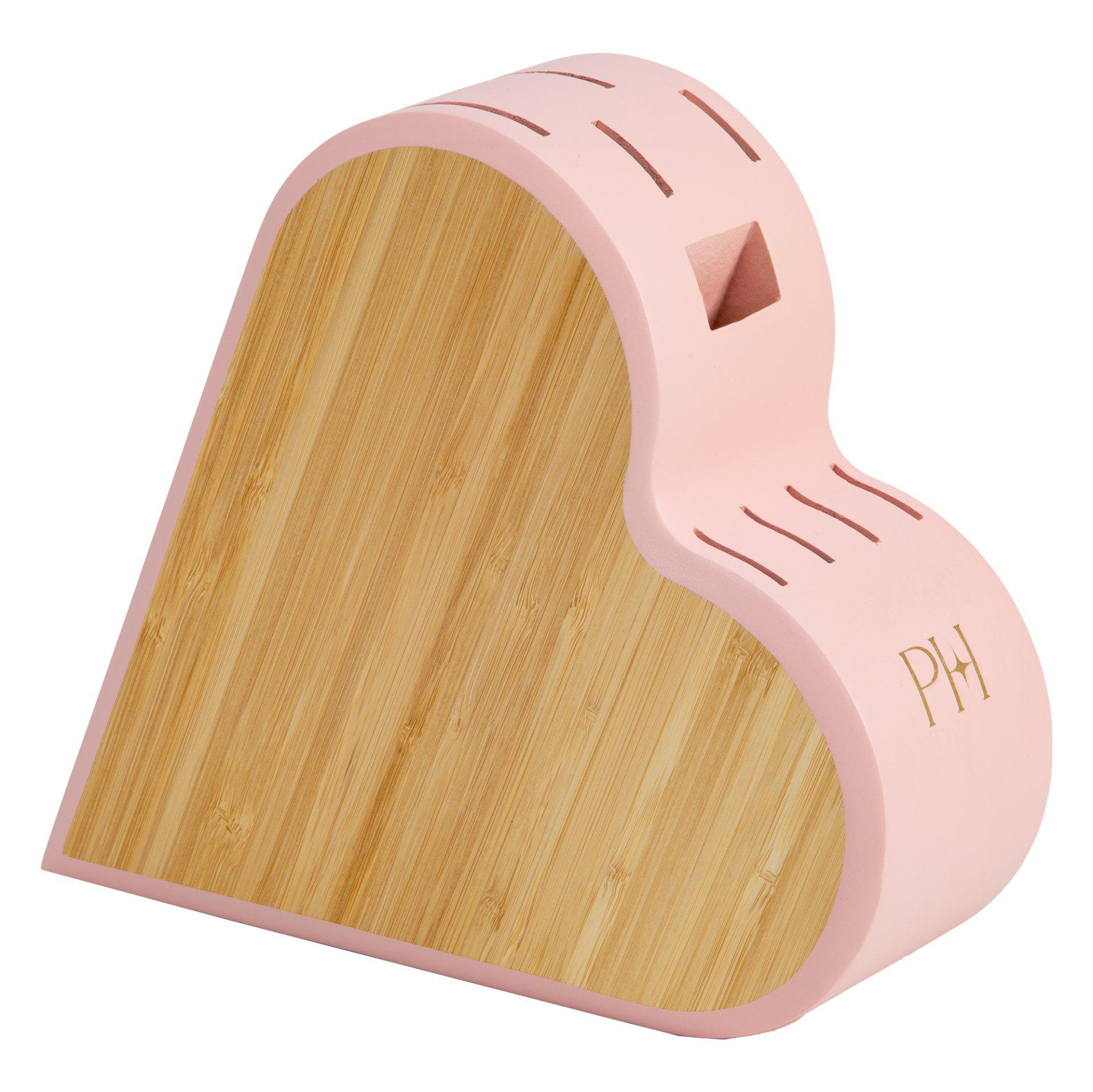 Ein herzförmiger rosa Messerblock mit Holzsockel und Schlitzen. Die Buchstaben PH sind sichtbar.