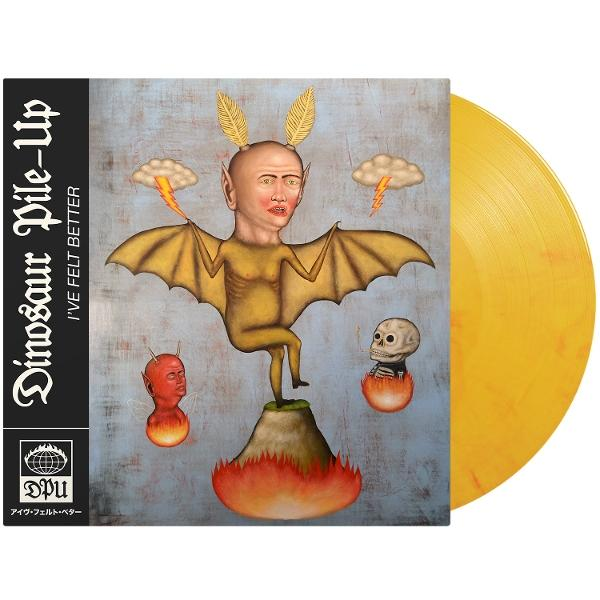 Albumcover: fledermausflügelige Figur mit menschlichem Gesicht, steht auf Vulkan. Gelbe Vinyl-Schallplatte rechts.
