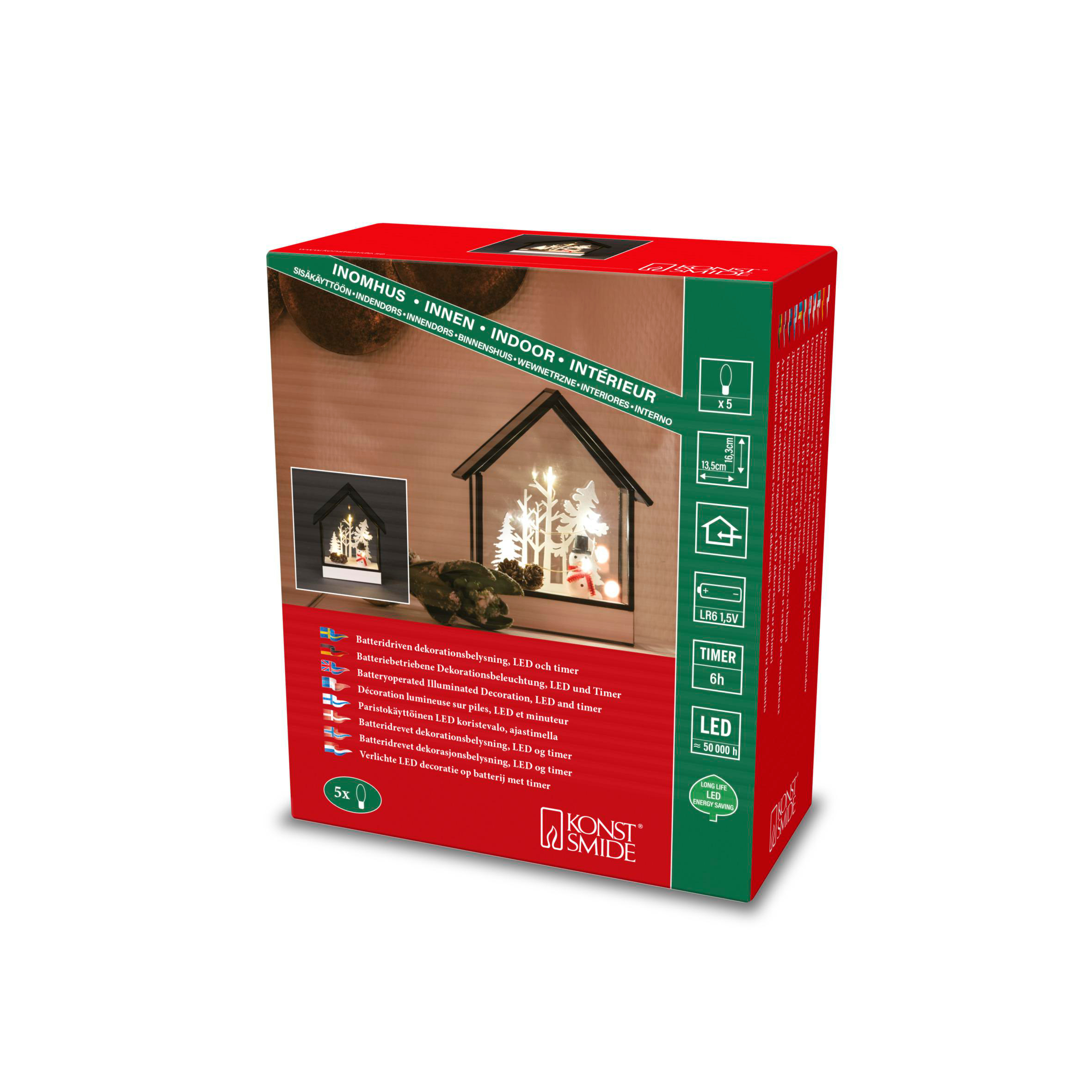 Schachtel mit beleuchteter Weihnachtsszene. Texte in mehreren Sprachen, darunter Englisch, beschreiben das Produkt.