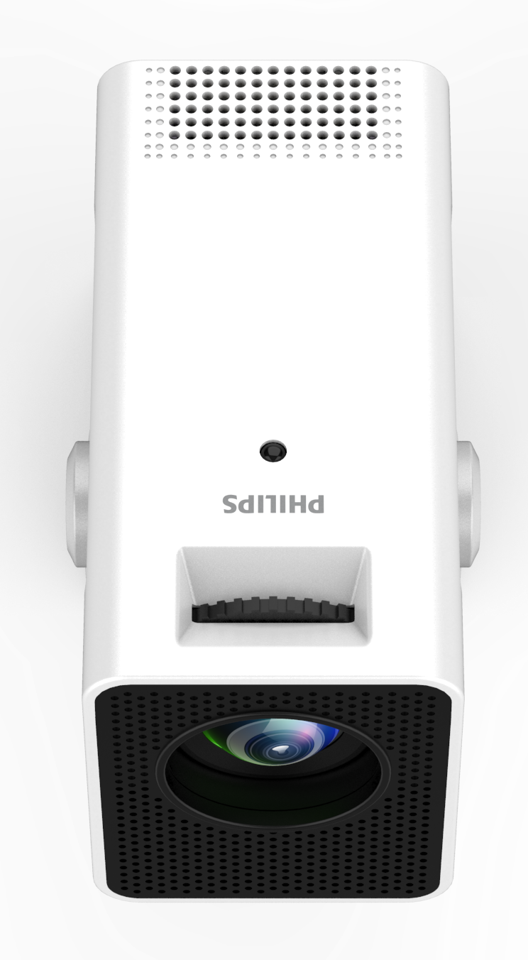 Biały projektor Philips z obiektywem i otworami na głośniki. Logo Philips znajduje się z przodu. Srebrne pokrętła są po każdej stronie.