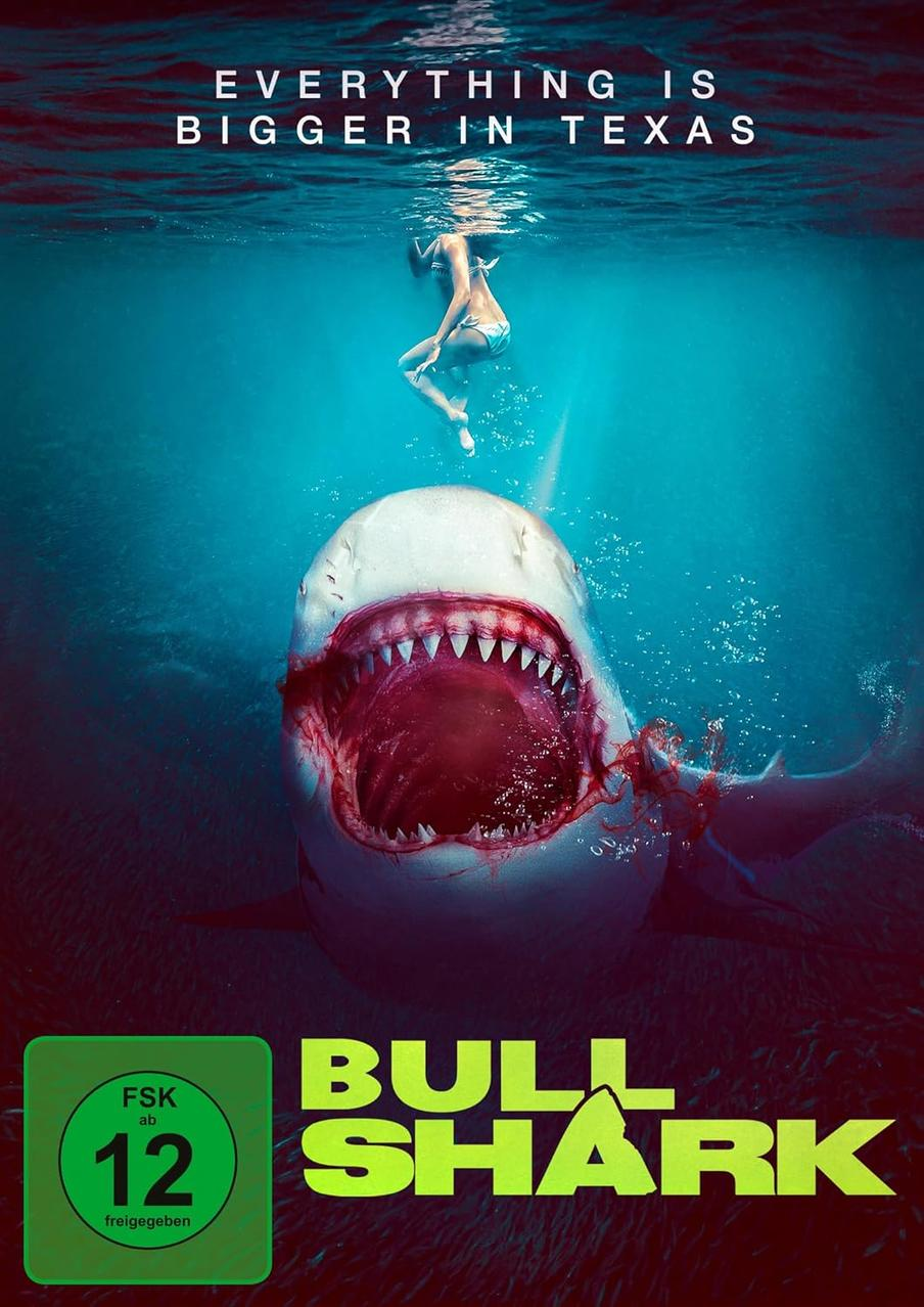 Ein Hai mit offenem Maul befindet sich unter einem Schwimmer. Der Titel 'BULL SHARK' ist sichtbar. Der Text 'EVERYTHING IS BIGGER IN TEXAS' steht darüber.