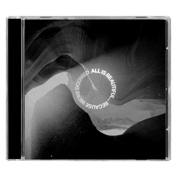 CD-Hülle mit schwarz-weißer abstrakter Grafik. Text in einem Kreis: 'Because we're doomed, all is beautiful...'