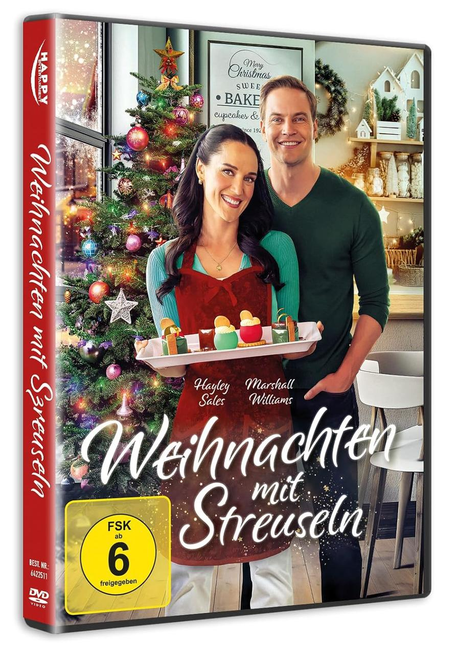 DVD-Cover zeigt ein Paar mit einem Tablett Cupcakes in der Nähe eines Weihnachtsbaums. Der Titel lautet 'Weihnachten mit Streuseln'.