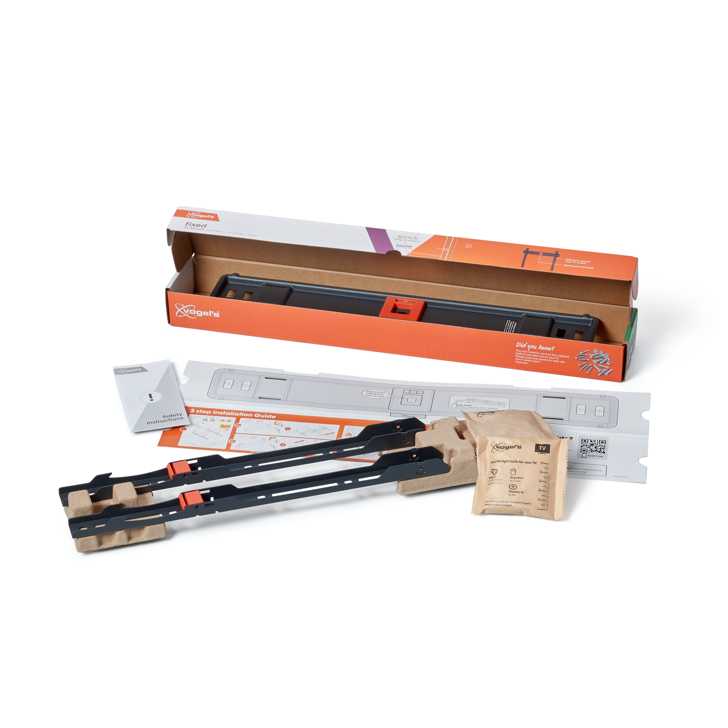 TV mount kit on a white surface. Includes box, instructions, and mounting hardware. Black and orange colors dominate the packaging.