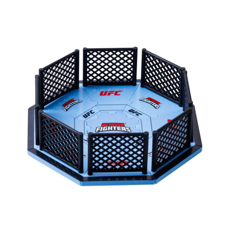 Miniatur-UFC-Achteck, blauer Boden mit 'UFC' und 'Fighters'-Logos, umgeben von schwarzem Zaun. Schwarz-Weiß-Farben.