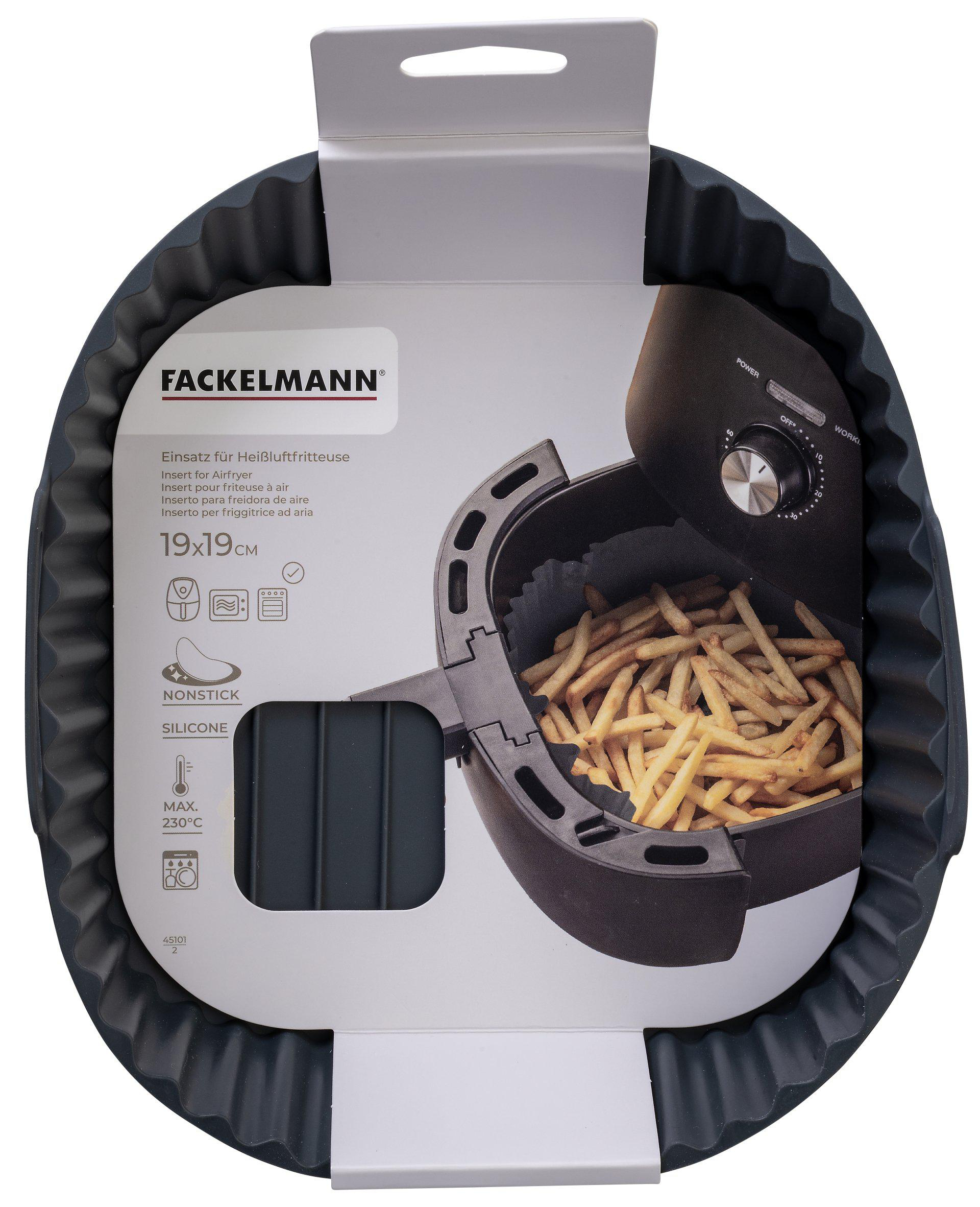 Ein Einsatz für eine Heißluftfritteuse mit Pommes frites. Die Verpackung weist auf 'Antihaft' und 'Silikon' hin.
