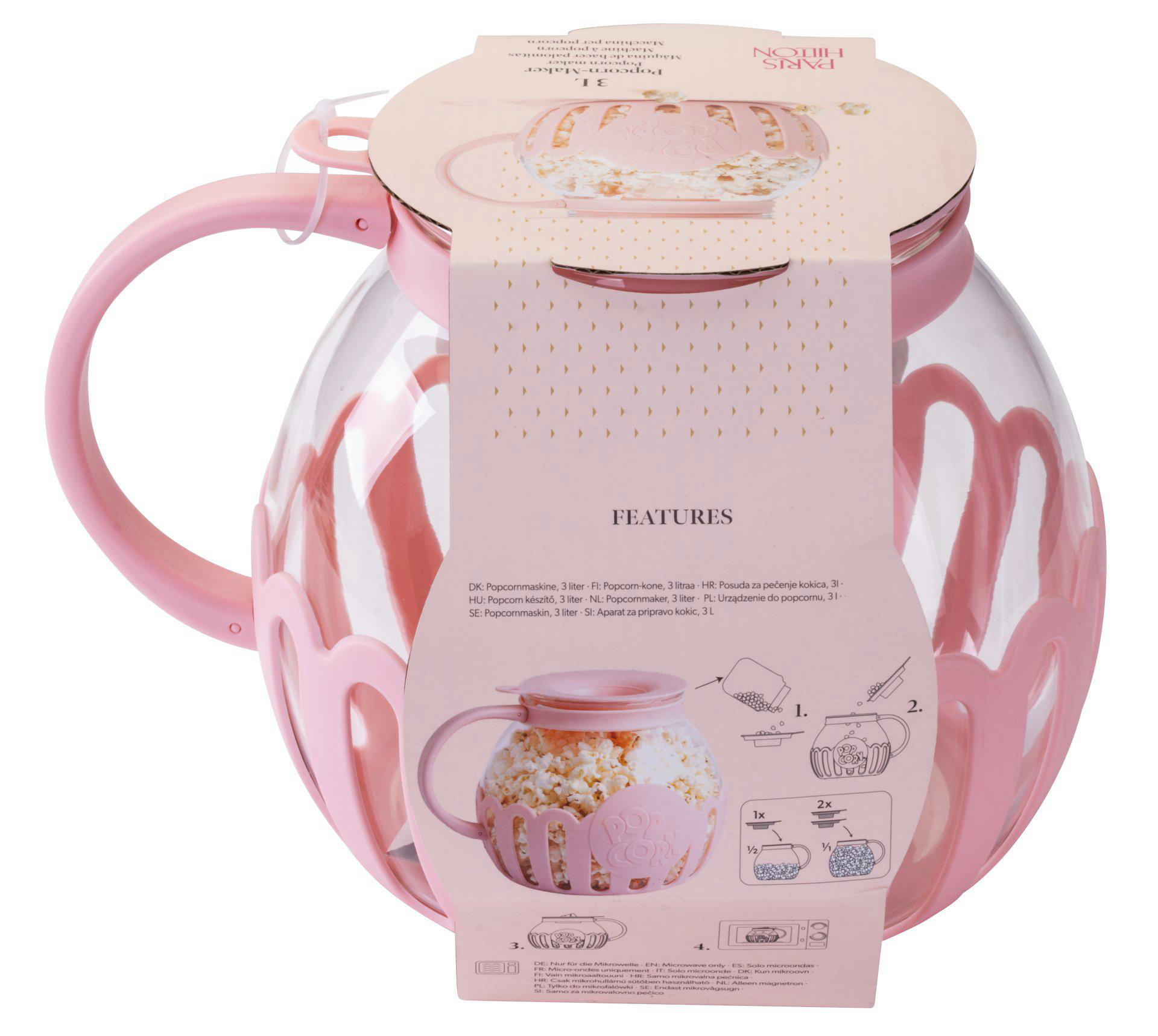 Ein rosa Paris Hilton Popcorn-Maker, gefüllt mit Popcorn, wird gezeigt. Enthält Anweisungen und Funktionen auf der Verpackung.