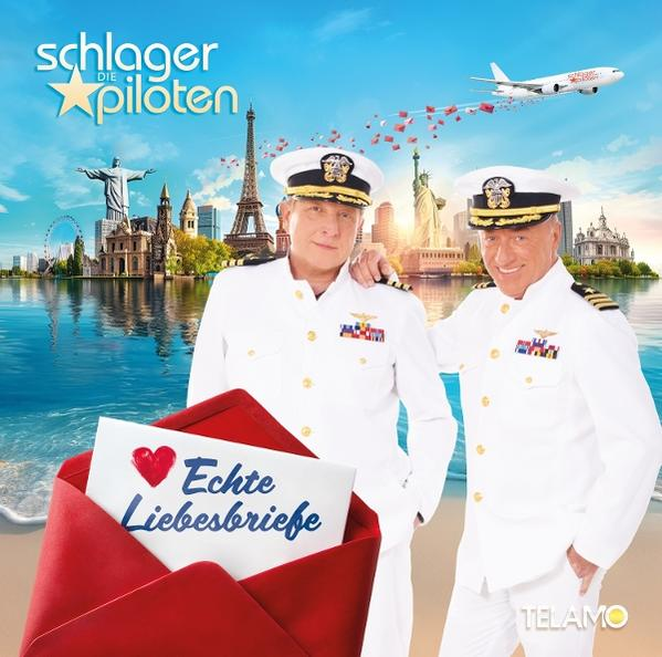Zwei Männer in weißen Uniformen, ein roter Umschlag mit Herz, Weltwahrzeichen und ein Flugzeug darüber.