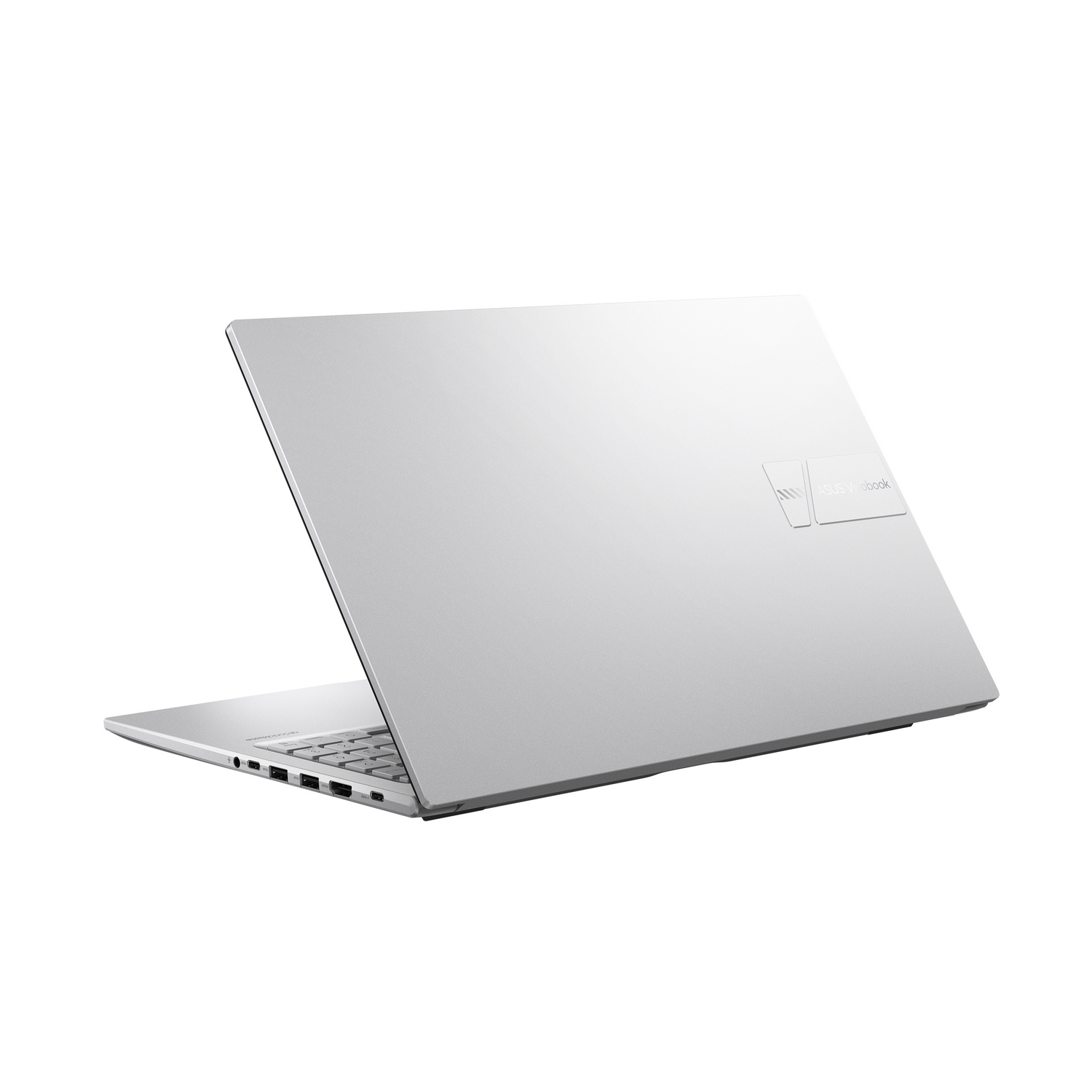 Un portátil plateado está ligeramente abierto, mostrando el teclado y los puertos. El logotipo de ASUS Vivobook es visible.