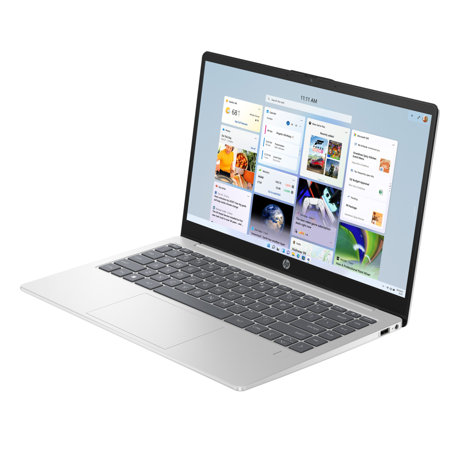 A silver HP laptop displays a news feed. The screen shows weather, news, and app previews. Keyboard in the foreground.