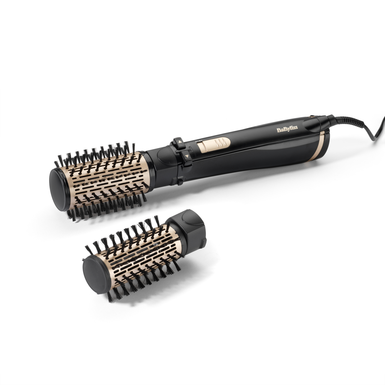 A black and gold Babyliss hair styler with two interchangeable brush heads, on a white background.