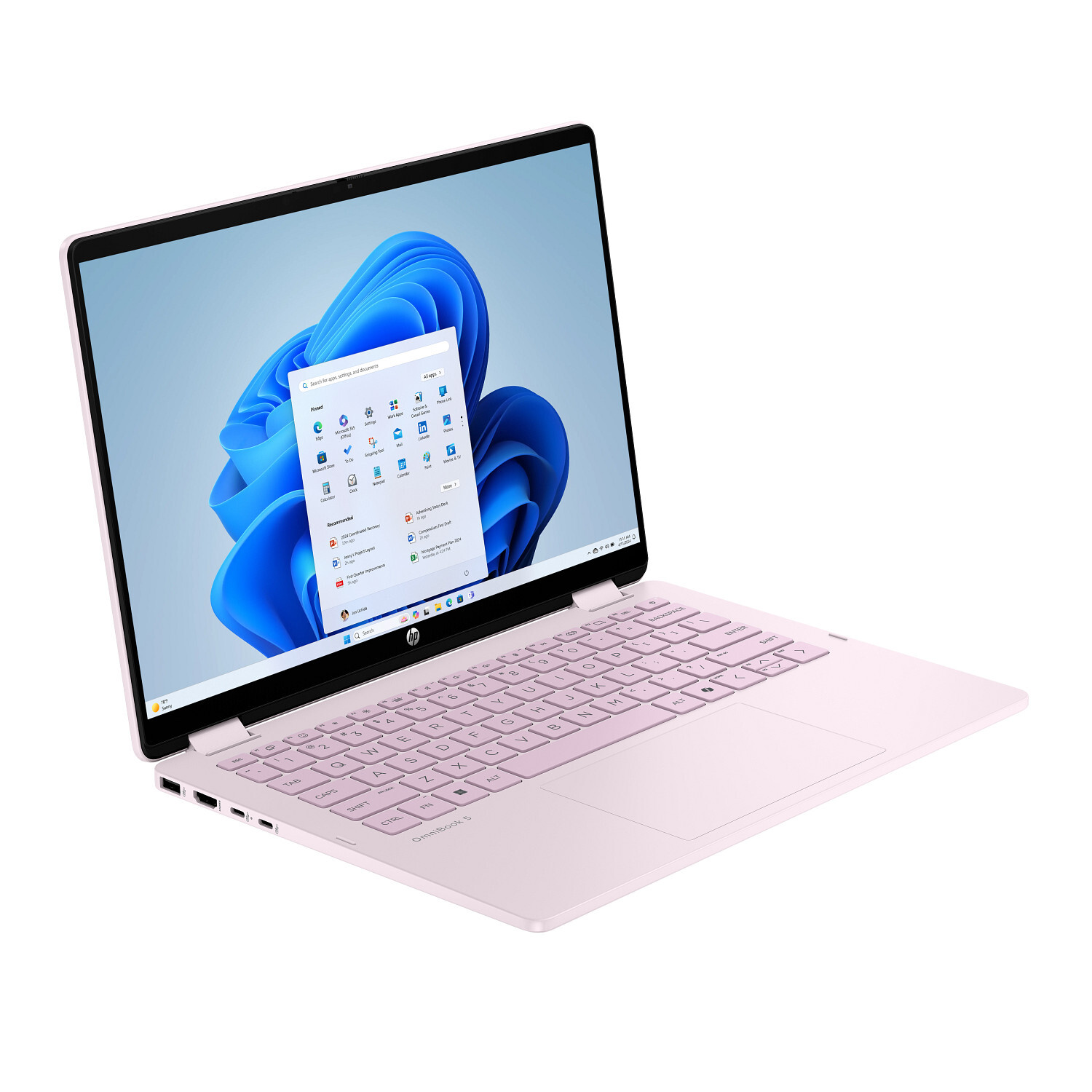 A pink HP laptop is open, displaying the Windows 11 interface. The keyboard and touchpad are visible. The screen shows app icons.