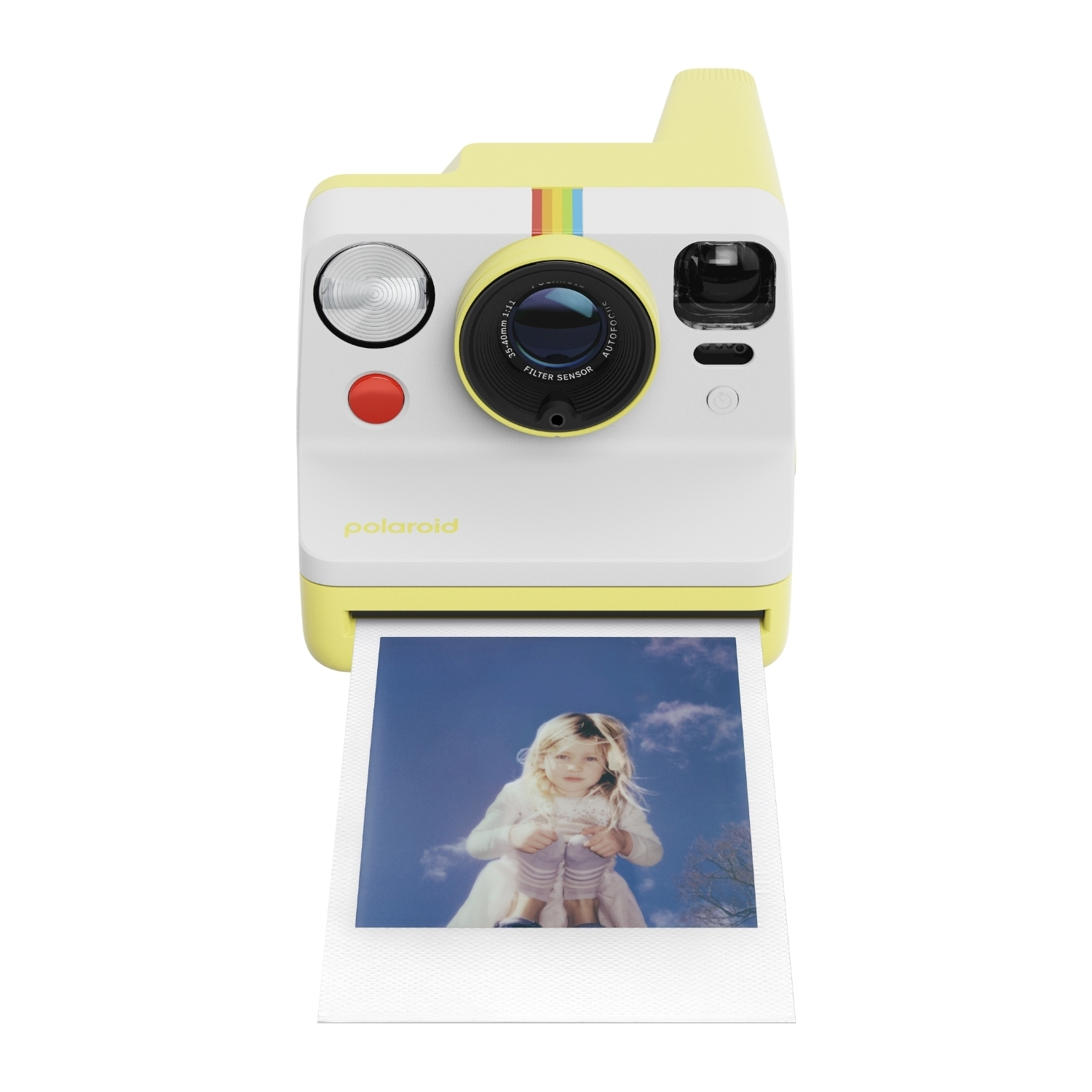Una fotocamera Polaroid gialla e bianca stampa una foto di una ragazza sotto un cielo blu.